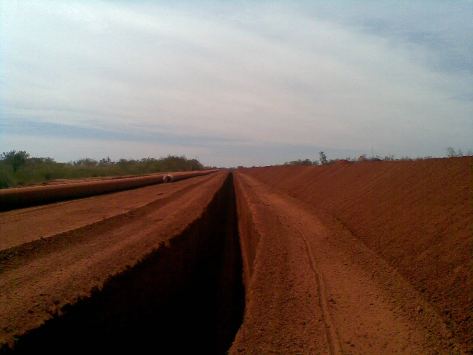 A dirt road with a dirt road on the side, showcasing civil engineering projects.